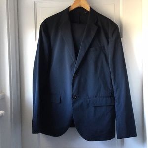 Navy Uniqlo tech fabric suit.